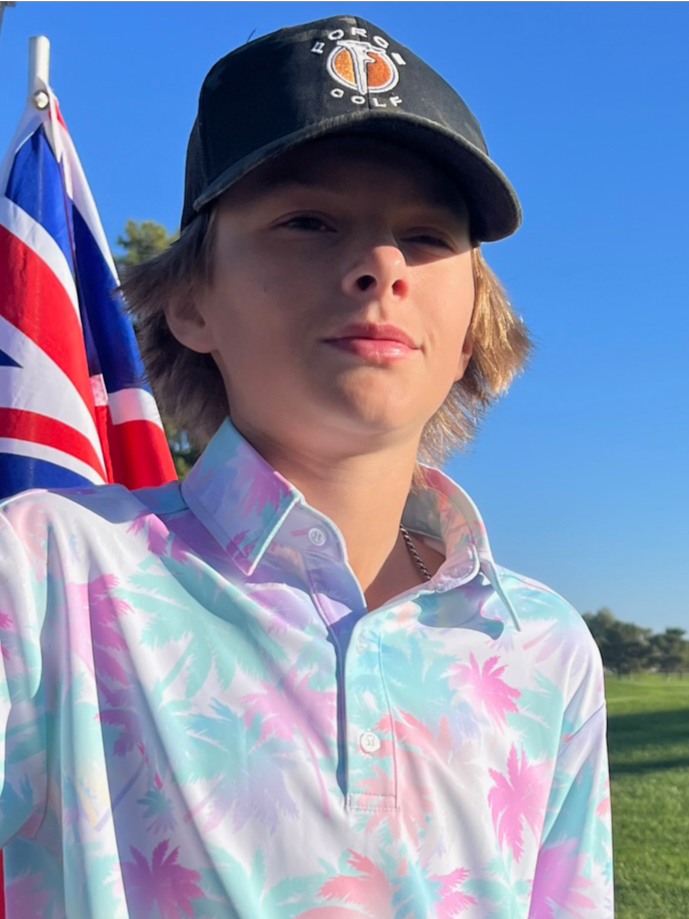 Vibrant white polo shirt with light fading blue and pink palm trees patterned throughout